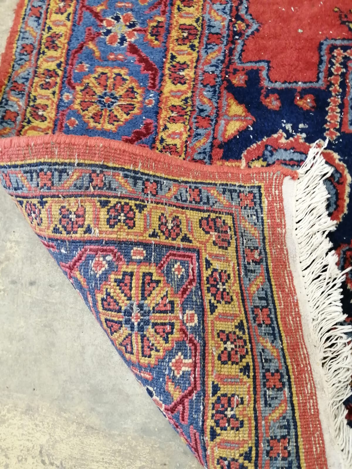 A Turkish red ground carpet, 337cm x 249cm